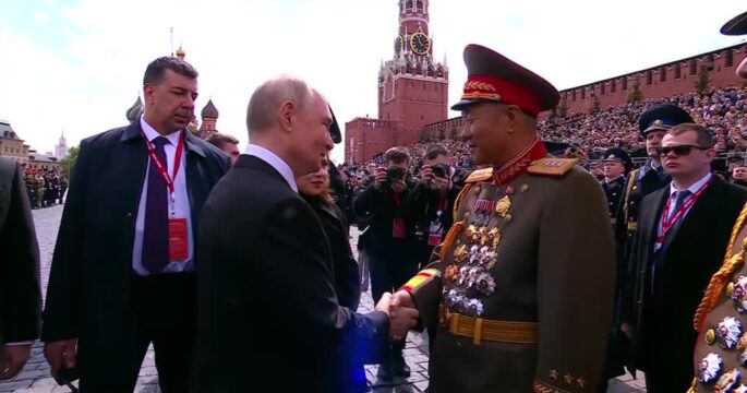 Putin embraces North Korean officials at WW2 Victory Day parade