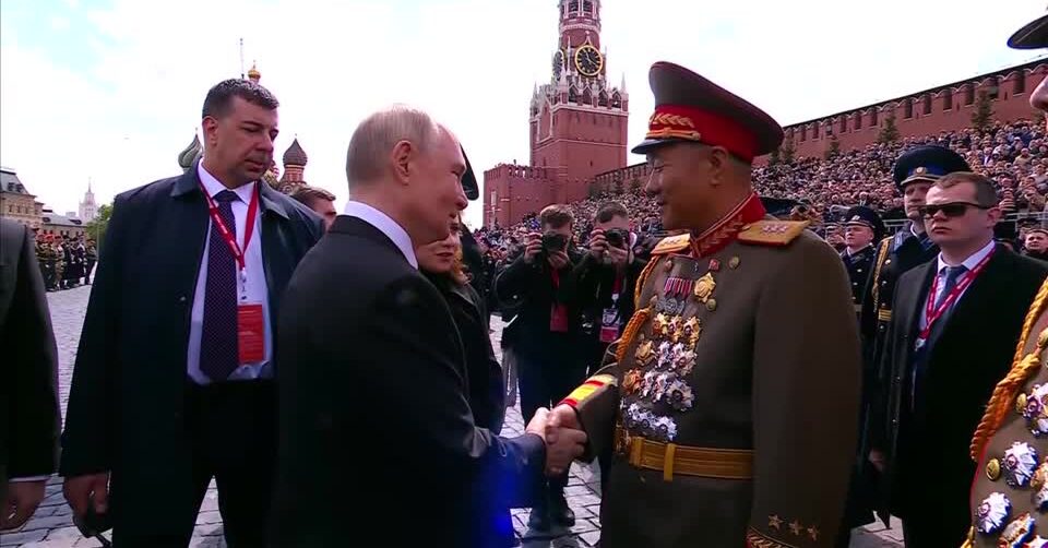Putin embraces North Korean officials at WW2 Victory Day parade