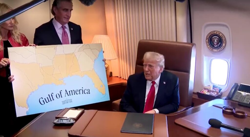 Trump talks with reporters on Air Force One Feb 9, 2025 with map of Gulf of America