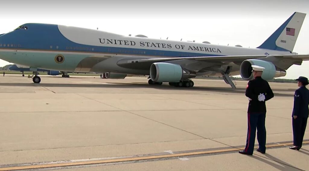 officers guard in front of Air Force One