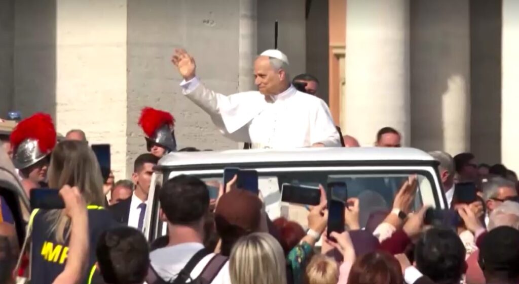 Pope Leo waves to the faithful as he arrives at St. Peter's Square