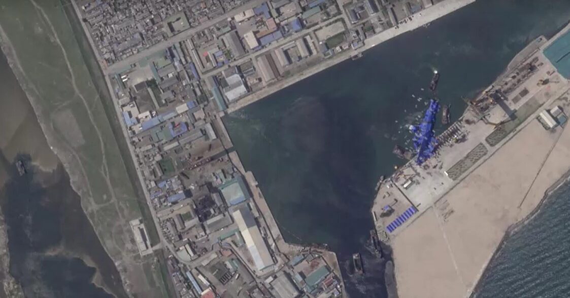 satellite images show North Korean warship covered with tarp