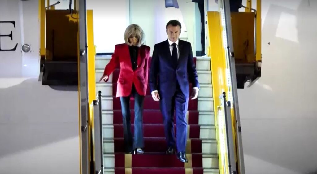 French president Macron and wife walk down plane in Vietnam
