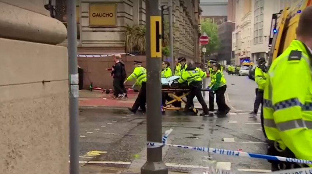 Emergency crew helps pedestrians being hit during Liverpool title parade