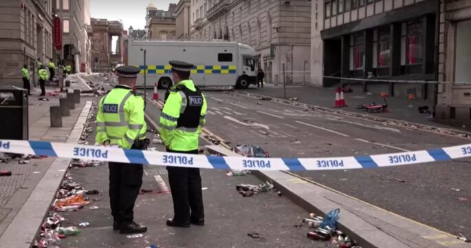 Police at scene morning after car plows into fans at Liverpool parade