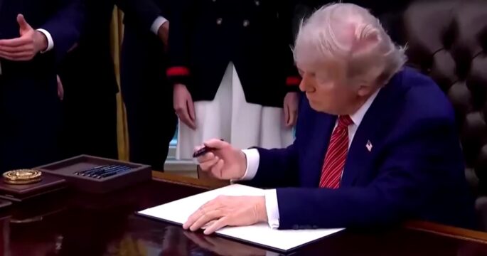 Trump signing an order