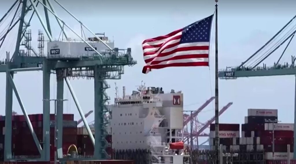 shipping containers in LA with American flag flying
