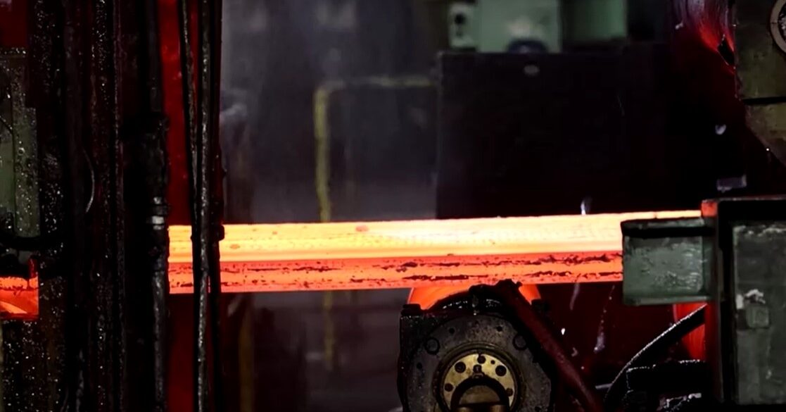 Steel coins being flattened and cooled