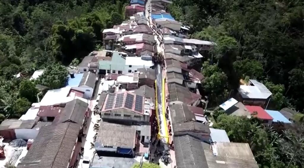 Colombian small village turns main street into giant slide