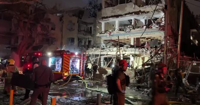 Emergency workers at aftermath of Iranian missile strike on Tel Aviv