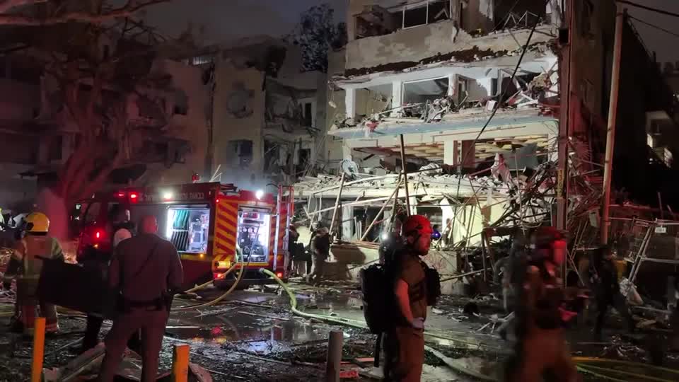 Emergency workers at aftermath of Iranian missile strike on Tel Aviv