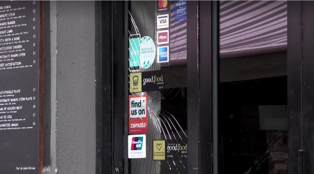 door damaged from Melbourne restaurant attack