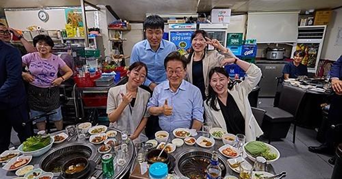 President Lee Jae Myung poses for a photo with his staff 11 July 2025