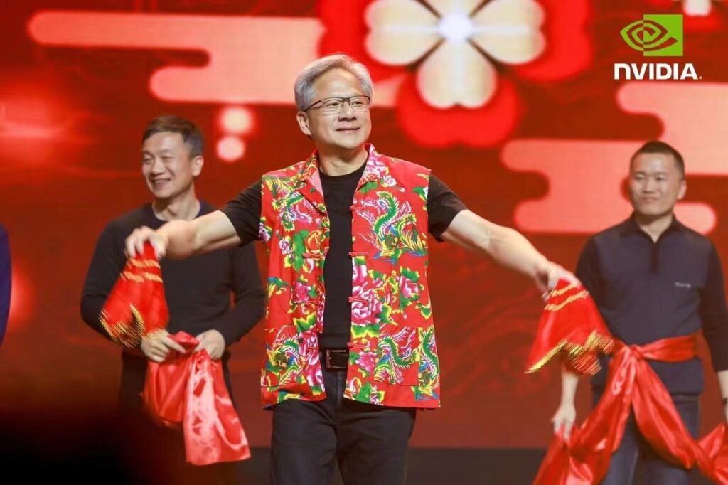 Jensen Huang dancing in a red vest 