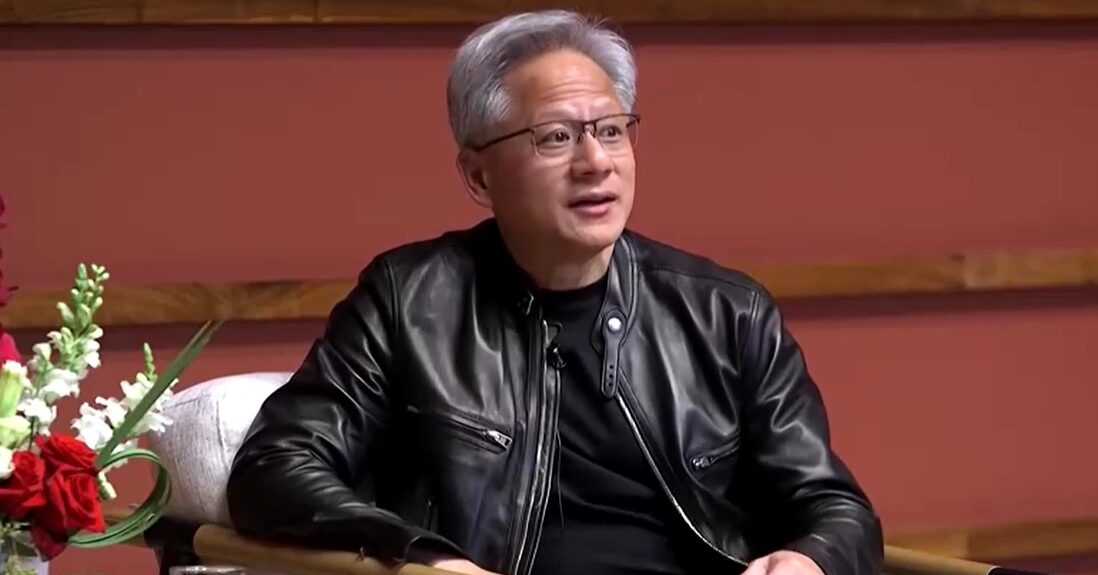 Jensen Huang sits
