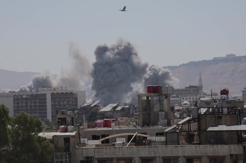 Smoke rises after strikes on Syria's defense ministry in Damascus