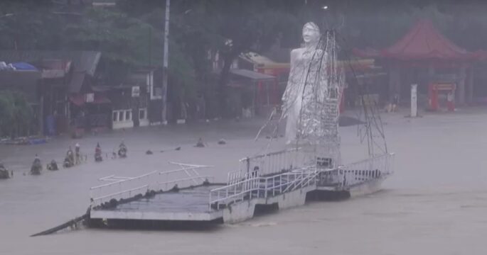 Statue submerged from flood in Manila
