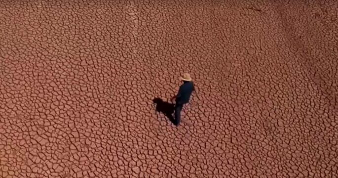 person walks on cracked ground in Mexico Jun 2024