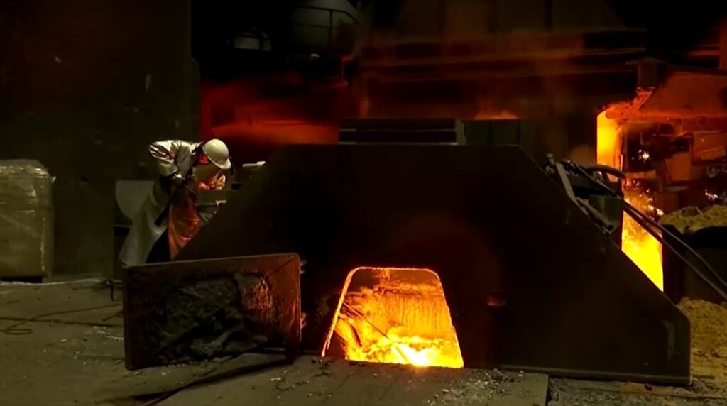 worker in steel production plant