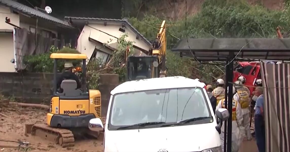 heavy machine working at site of landslide in Kumamoto, Japan