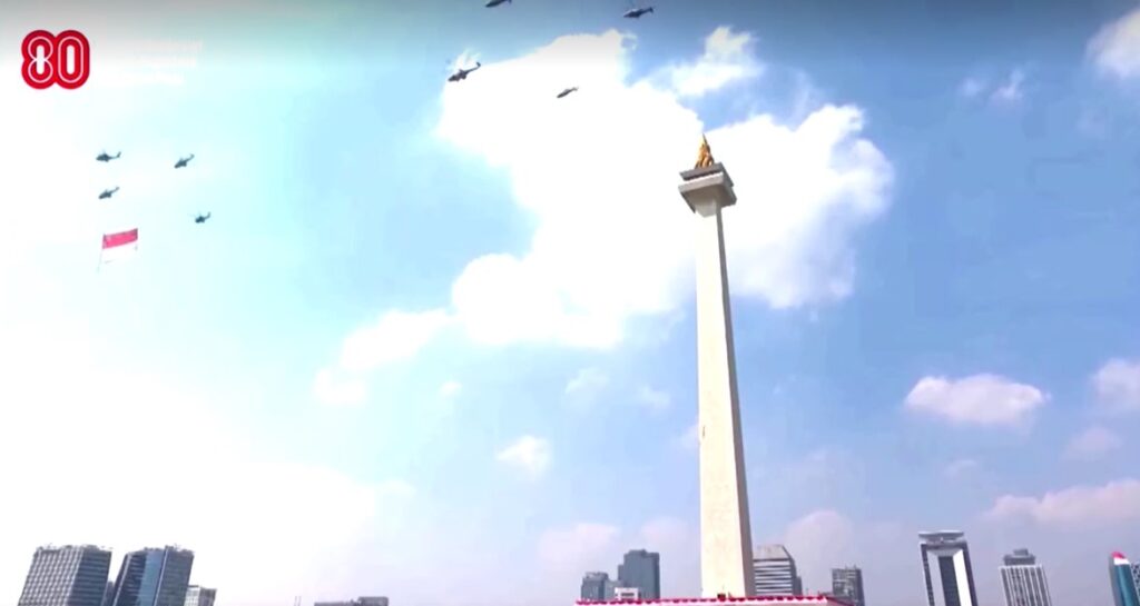 Indonesia helicopters fly flag over Monas