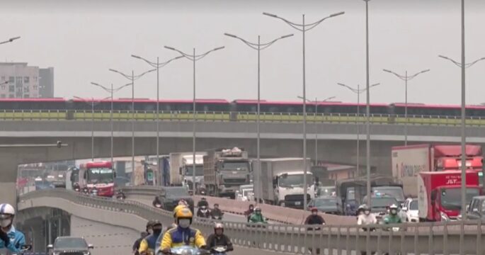 sky train and vehicles on road in Hanoi, Vietnam