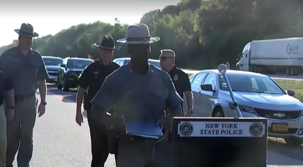 New York State police at press conference on bus accident