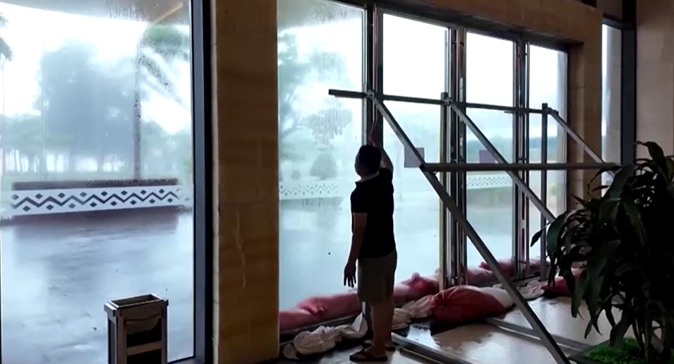 reinforced glass and door from typhoon Kajiki lashes Vietnam