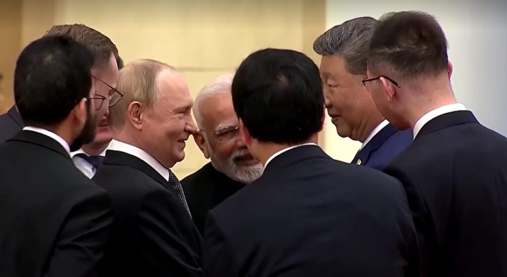 Putin, Modi and Xi closely talking