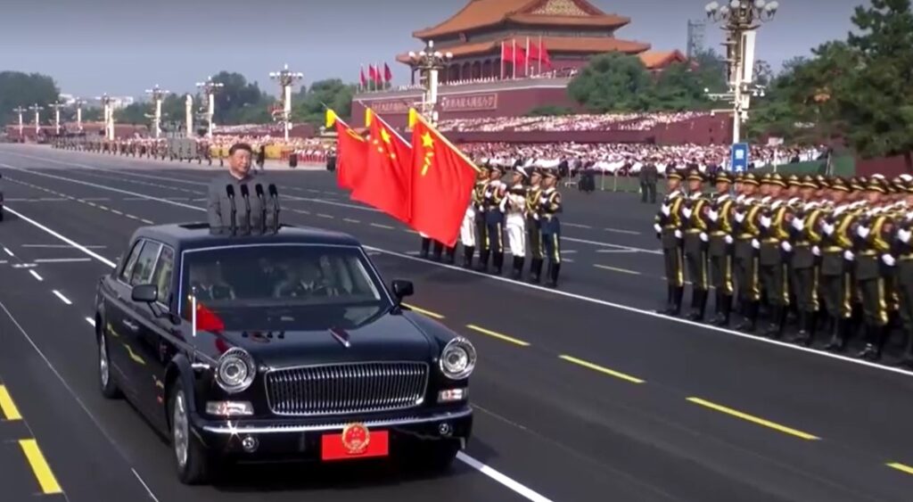 Xi riding in vehicle to inspect troops