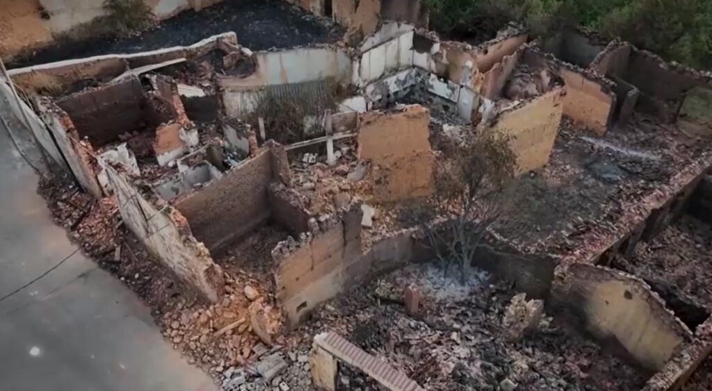 drone view of destroyed building from wildfire in Spain