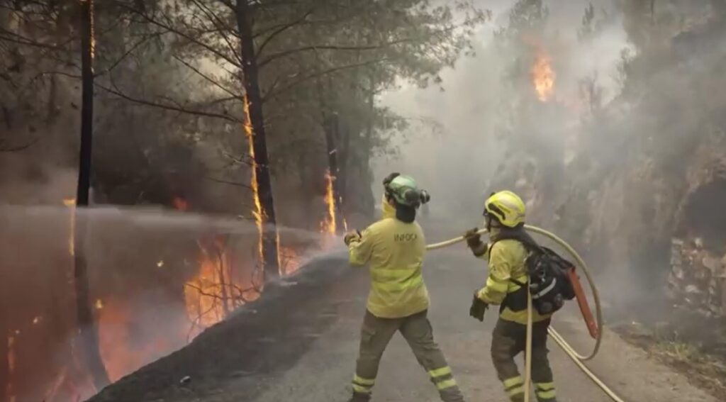 firefighters controlling wildfire in Spain