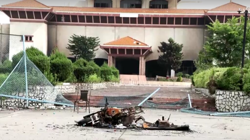 burnt motorcycle left in front of Nepal Parliament