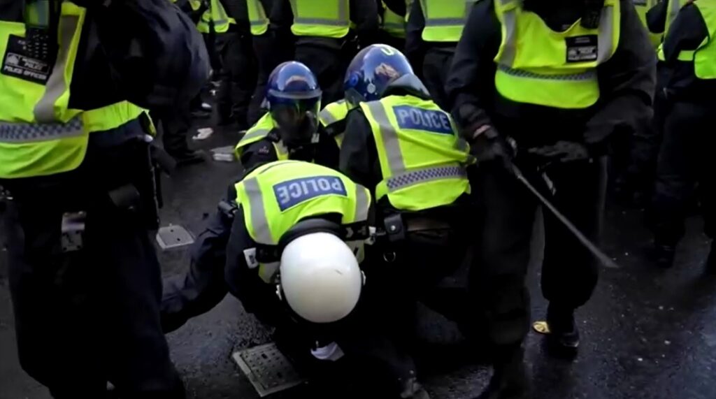 London police arrest protester