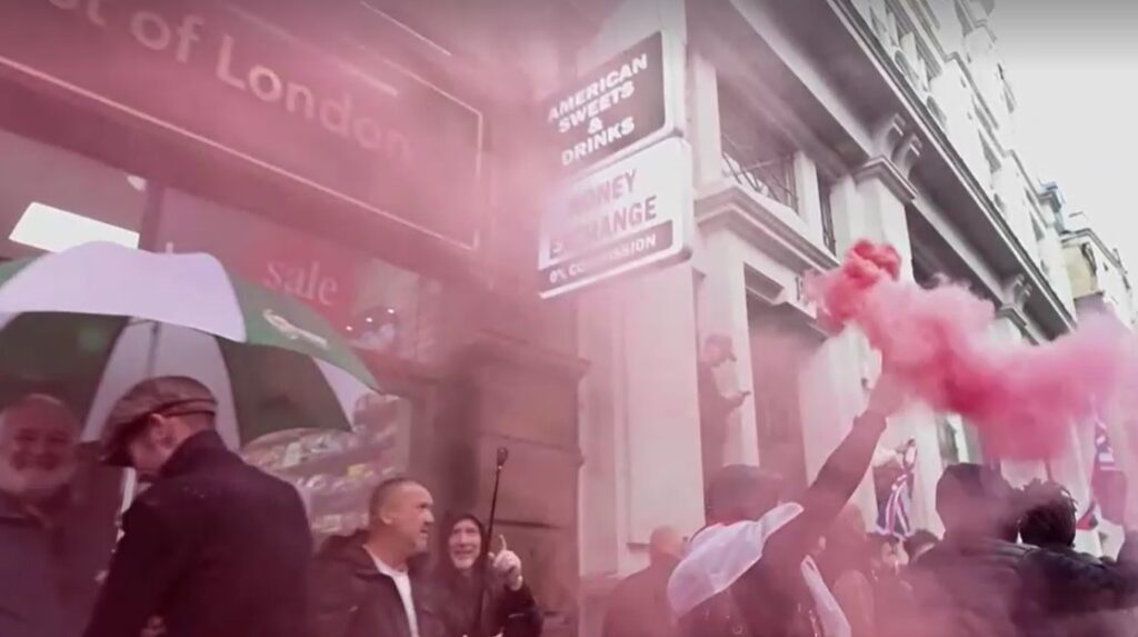 Protester raises flare in London anti-immigration march