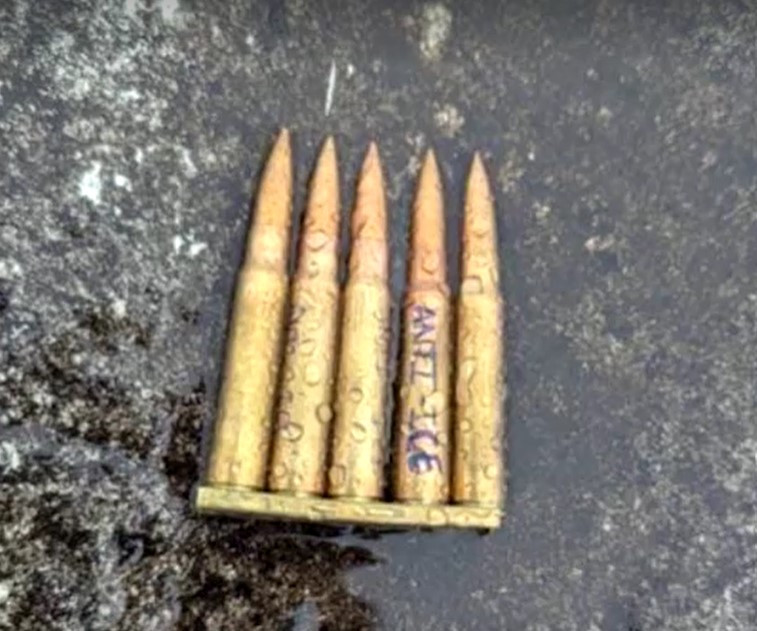 Unspent shell casings left by iICEshooter with Anti ICE written on one of them