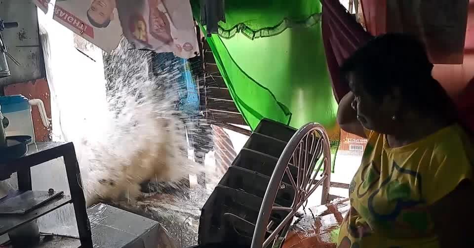 Towns flooded as tropical storm batters the Philippines