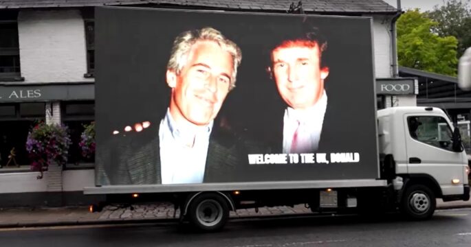 A van displaying a photo of Trump with Epstein during Trump's England visit Sept.17,2025